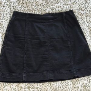 Black jean skirt. Can be worn highwaisted